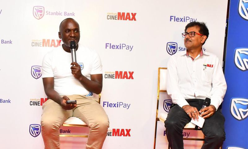 Stanbic's Israel Arinaitwe and Satish Guna, the Century Cinemax General Manager address press