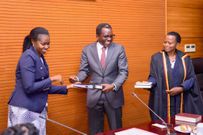 Minister of State for Northern Uganda, Kenneth Omona Olusegun, handed over office to the new PPS, Asio Gloria Omaswa.