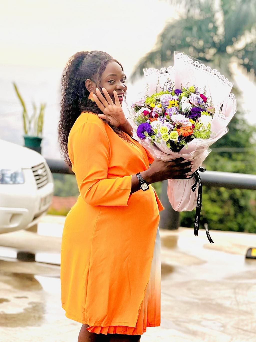 TV Personality precious Remmy showing off her flowers