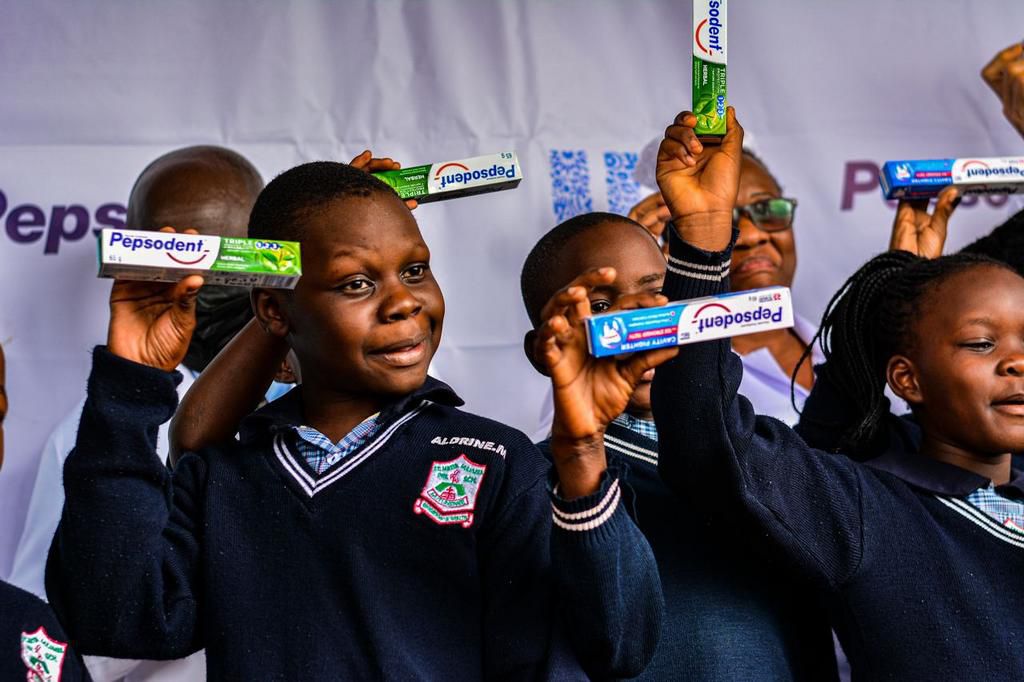 School-goers receiving their oral health care packages
