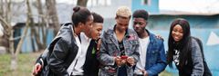 Young people having fun and using technology