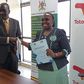 Alfred Okot Okidi, Permanent Secretary of MWE, and Mariam Nampeera Mbowa, Deputy General Manager of TotalEnergies EP Uganda at the MOU signing