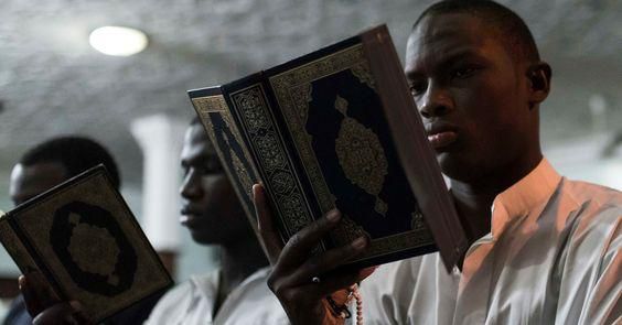 Young man reading the Quran/Courtesy/Huffingtonpost