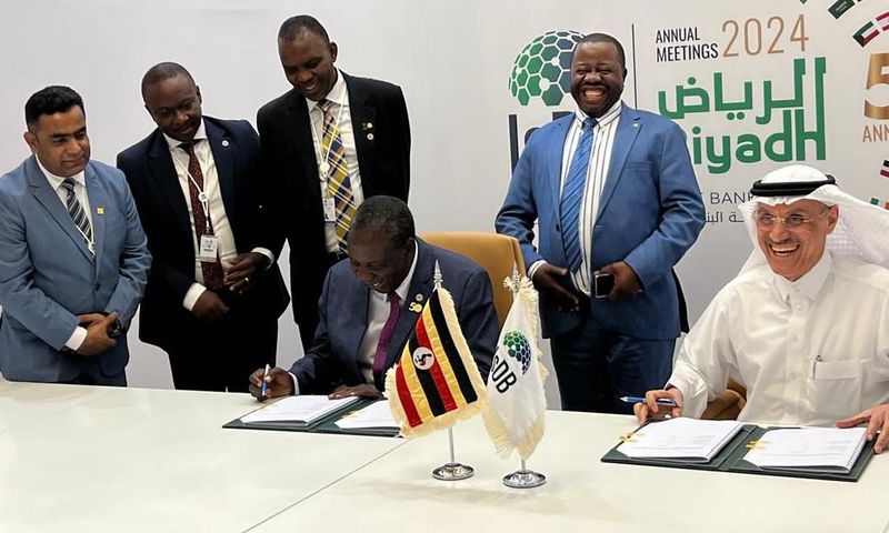 Matia Kasaija signed the loan deal on behalf of Uganda
