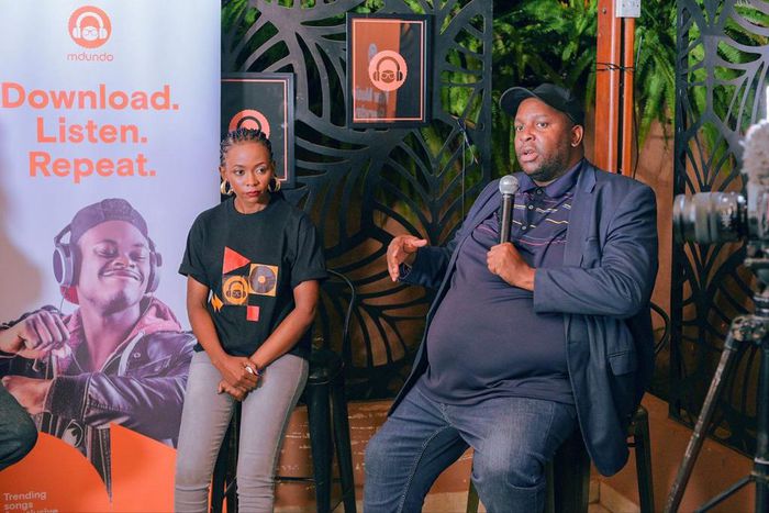 Serah Adong, licensing manager at Mdundo (L) and Jeff Ekongot, the chief executive officer of Uganda Musicians Association