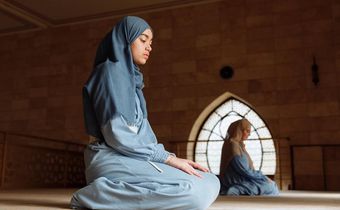 A Muslim woman during prayer time [Image Credit: Thirdman]