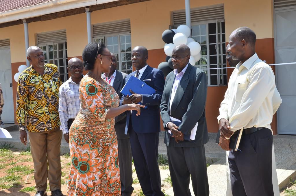 Minster Kaboyo interacts with some of the school administrators and local leaders