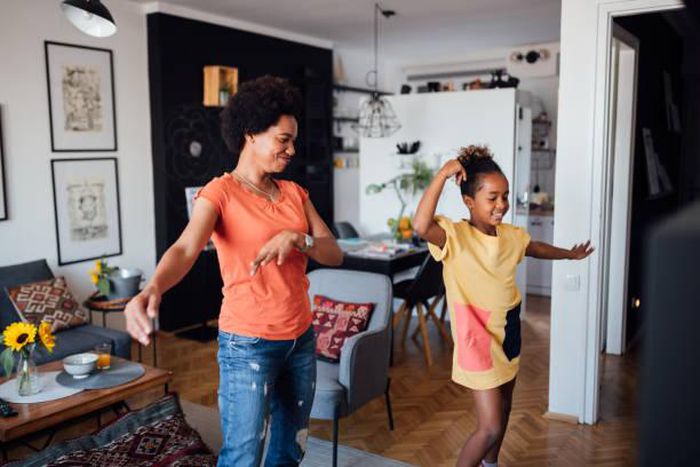 A nanny paying with a child