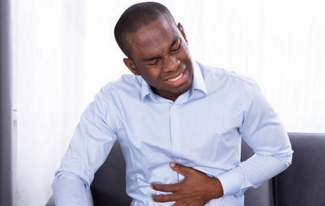 A man suffering from heartburn