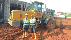 Atwine (right) with one of his workmates at a construction site