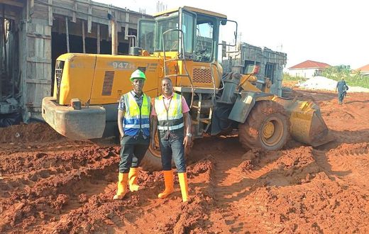 Atwine (right) with one of his workmates at a construction site