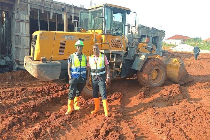 Atwine (right) with one of his workmates at a construction site