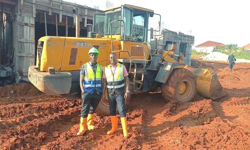 Atwine (right) with one of his workmates at a construction site