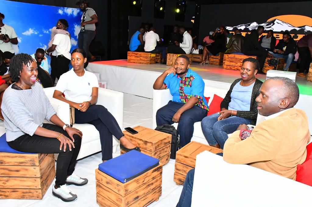 Stanbic Bank Uganda team sharing light moments during the Media Launch  at Next Media Park, in Naguru, Kampala