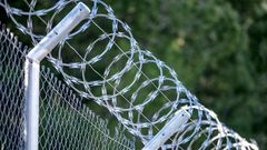 A metal fence with barbed wireJose A. Bernat Bacete/Getty Images