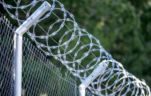 A metal fence with barbed wireJose A. Bernat Bacete/Getty Images