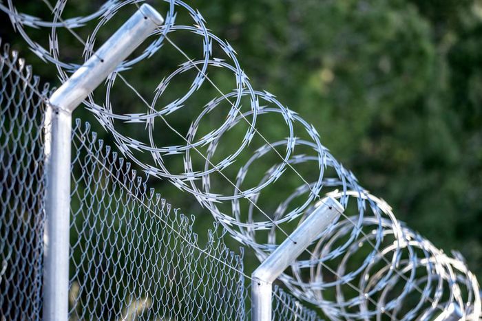 A metal fence with barbed wireJose A. Bernat Bacete/Getty Images