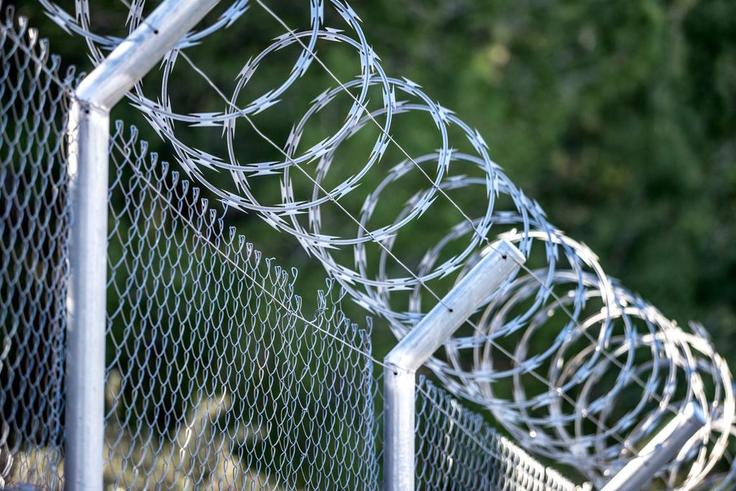 A metal fence with barbed wireJose A. Bernat Bacete/Getty Images