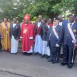 Charles Peter Mayiga and Archbishop Semogerere pose with Christians after the Martyrs Day mass in Boston