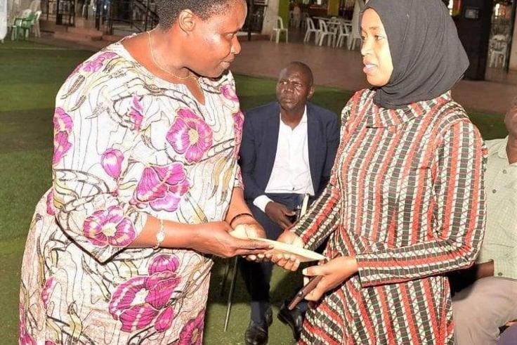Vice President Jessica Alupo with one of the victims' family member