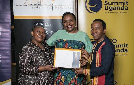 Next Media's Lilian Mutesi receiving her certificate of attendance at the CEO Apprenticeship Program (CAP)program
