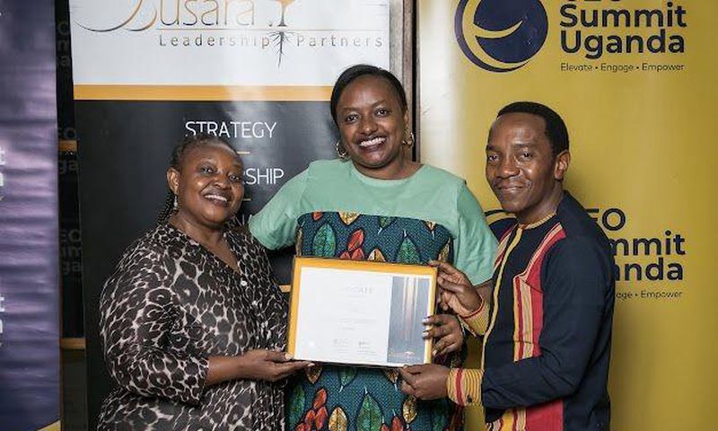Next Media's Lilian Mutesi receiving her certificate of attendance at the CEO Apprenticeship Program (CAP)program