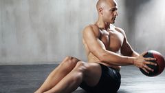 A man doing Russian twists