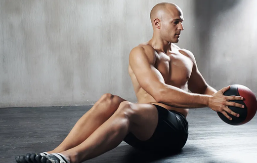A man doing Russian twists
