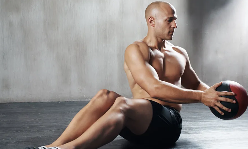 A man doing Russian twists