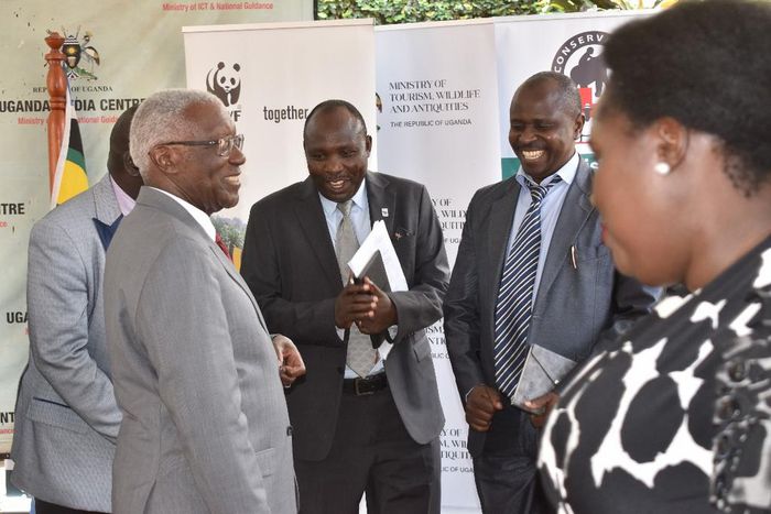 Minister Tom Butime and officials from WWF at the press address