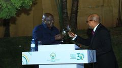 Minister Okello Oryem toasts with Rwanda’s High Commissioner to Uganda, Joseph Rutabana.