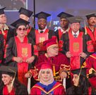 Ham Kiggundu posed with fellow graduands