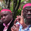 Lukwago (behind) and Besigye