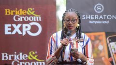 Evelyn Nansikombi the UBL Acting Brand Manger, Baileys gives a specch at the Bride and Groom Expo launch at Sherato Kampala Hotel