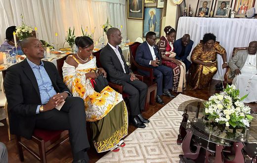 Minister Norbert Mao (in glasses) was introduced by his lover Beatrice on Sunday