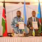 Hon. Kipchumba Murkomen (Cabinet Secretary, Ministry of Roads and Transport, Kenya), Hon. Jimmy Gasore (Minister of Infrastructure, Rwanda), and Hon. Fred Byamukama (Uganda's State Minister for Transport) display a signed report following the Joint Min...