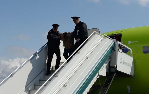 Troublemaker removed from a plane (image used for illustrative purpose) [Shutterstock]