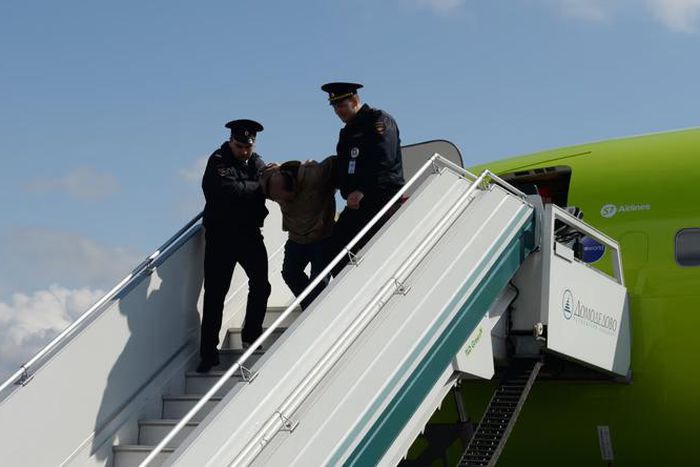 Troublemaker removed from a plane (image used for illustrative purpose) [Shutterstock]