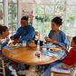 Family sharing a meal/Courtesy/Yahoo Life