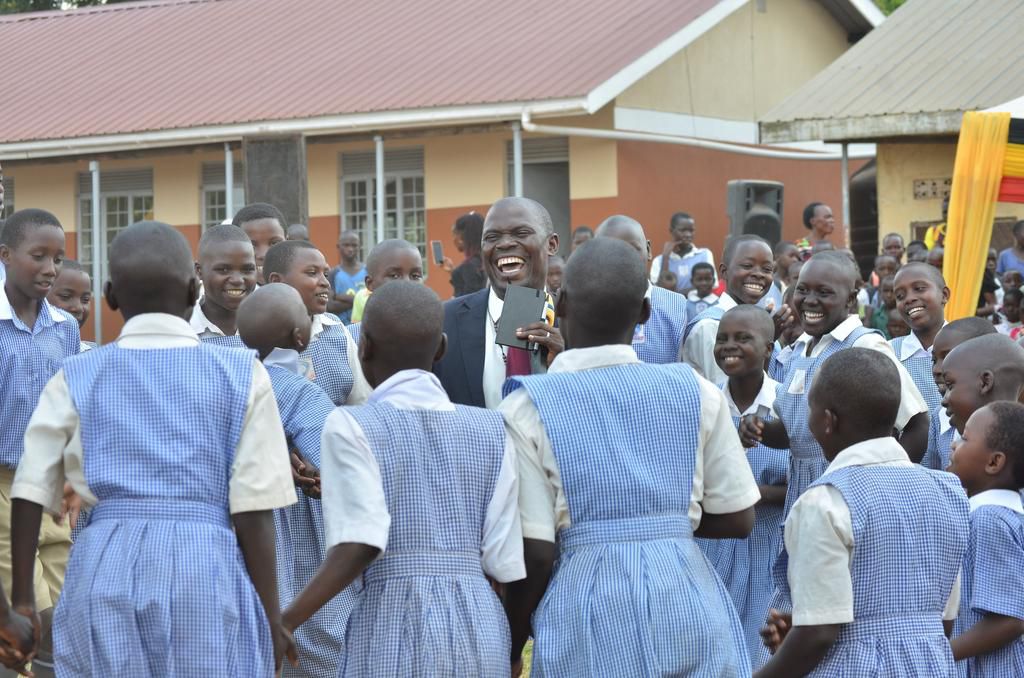 Minister Keefa Kyofatogabye with some of the learners