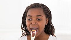 A lady tongue scrapping