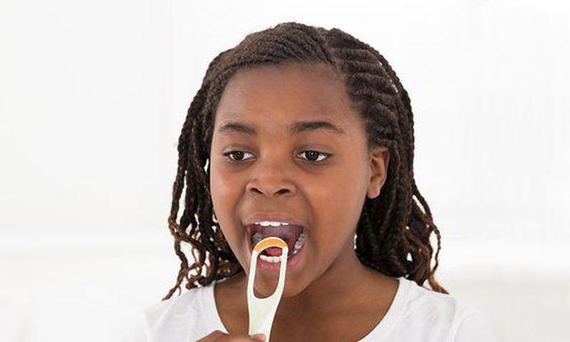 A lady tongue scrapping