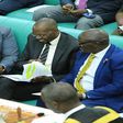 Works Minister, Katumba Wamala (R), deputy attorney general Jackson Kafuuzi (C), and Committee Chairperson Dan Kimisho confer during the debate on the bill