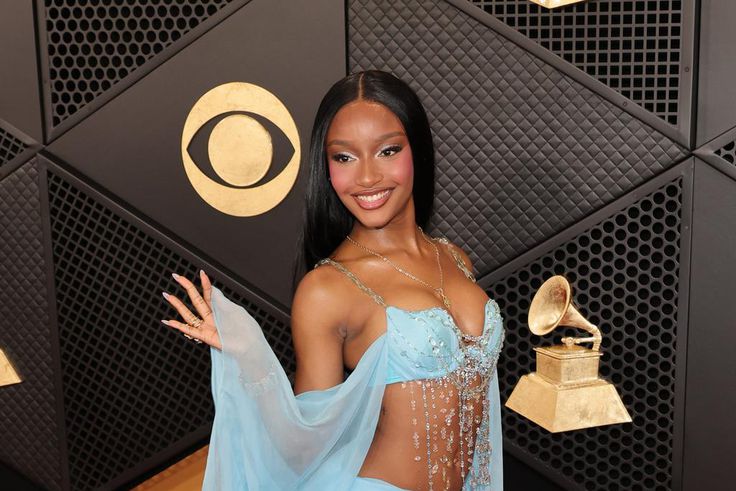 Ayra Starr wore a daring baby-blue two-piece ensemble decorated with silver gemstones.