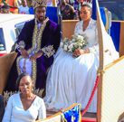 Namusoke in the royal carriage with the King and the Queen