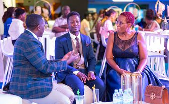 L-R: Brian Mulondo, the local content manager of MultiChoice Uganda, Jerry Sesanga the show director and Bina Baibe the host of the show, during the premiere of Mum Vs Wife.