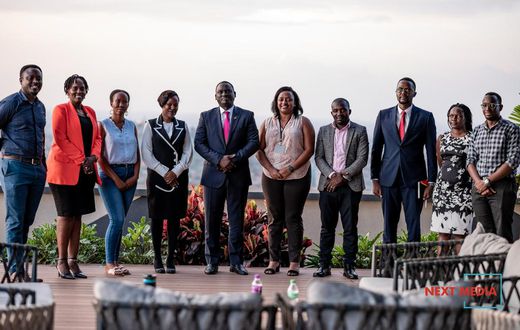 Uganda Marketer's Society newly constituted UMS Executive Committee posing for a photo with Next Media Group CEO, Kin Kariisa (center)