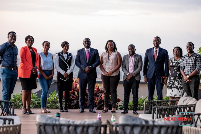 Uganda Marketer's Society newly constituted UMS Executive Committee posing for a photo with Next Media Group CEO, Kin Kariisa (center)