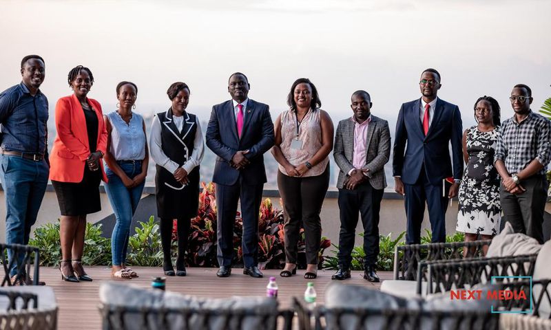 Uganda Marketer's Society newly constituted UMS Executive Committee posing for a photo with Next Media Group CEO, Kin Kariisa (center)