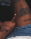 Abryanz's tattoos; "Freedom", "Scorpio", and a moth.